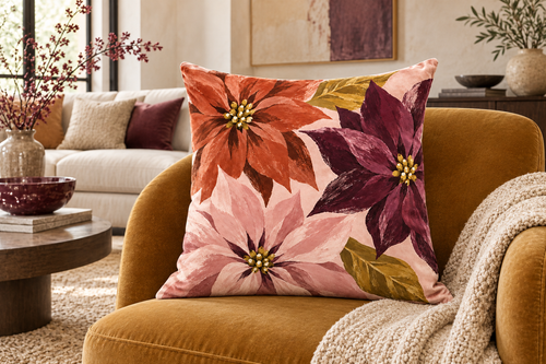 Abstract Poinsettia Christmas Printed Velvet Pillow Cover, lifestyle view 1: Placed upright on an accent chair, nearly frontal with full print clearly visible; room-wide interior composition.