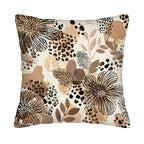 A square decorative throw pillow cover isolated on a pure white background, featuring a modern abstract design with hand-drawn wildflowers, tropical leaves, and leopard spots in a warm palette of beige, tan, terracotta, and black.