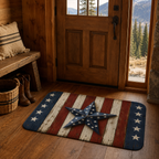 Rustic Americana stars and stripes doormat placed on a wooden floor by a cabin front door entry.