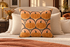 Art Deco Pumpkin Fan Printed Pillow Cover, lifestyle view 3: Centered in front of plain pillows on a neatly made guest bed; eye-level composition, believable 18-inch pillow scale.