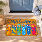 A vibrant beach-themed welcome mat with colorful flip-flops placed at the entryway of a light blue front door next to blue hydrangeas.