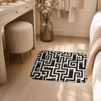 Black cat maze floor mat styled beside a warm bedroom vanity.