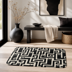 Black cat maze floor mat styled in a modern entryway space.