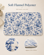 Blue floral flannel bath mat with soft texture and rounded edge details.