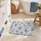 Blue toile floral floor mat placed in a bright bathroom.