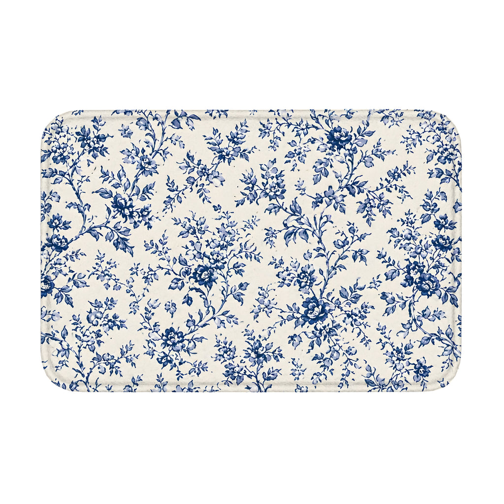 Blue toile floral floor mat with rounded corners on white background.