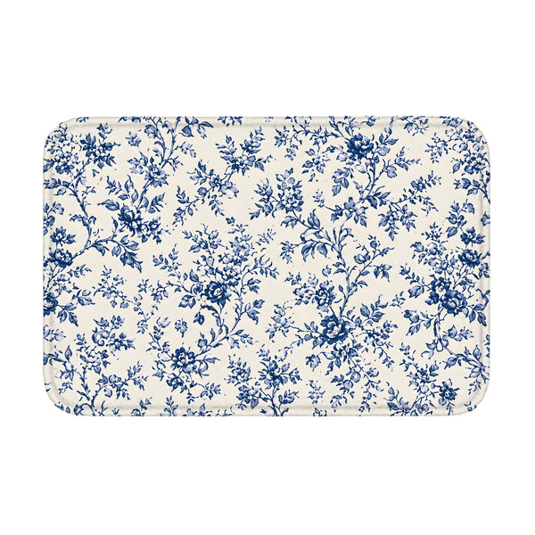 Blue toile floral floor mat with rounded corners on white background.