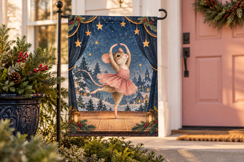 Christmas Ballet Mouse Printed Garden Flag, lifestyle view 1: One flag on a simple separate black L-shaped garden stake beside a front porch planter, all of the flag readable, late-afternoon natural light.