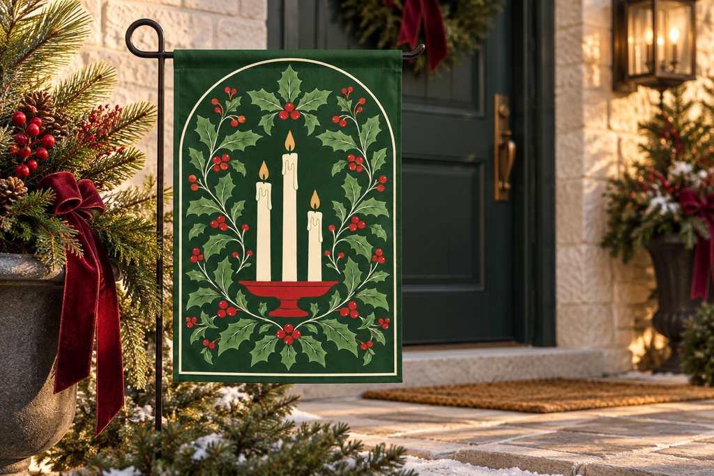 Christmas Candles & Holly Printed Garden Flag, lifestyle view 1: One flag on a simple separate black L-shaped garden stake beside a front porch planter, all of the flag readable, late-afternoon natural light.