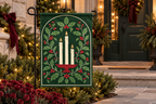 Christmas Candles & Holly Printed Garden Flag, lifestyle view 4: One flag on its separate black garden stake in a mailbox garden with restrained October seasonal planting, wide but product-led welcoming suburban scene.