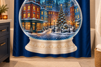 Christmas City Snow Globe Printed Shower Curtain, lifestyle view 2: Three-quarter view of a standard tub and square curtain, upper hardware cropped OUT OF FRAME, full printed motif visible with soft vertical folds, no window or fixture passing through cloth.