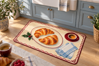 Christmas Croissant Breakfast Printed Floor Mat, lifestyle view 2: One mat on the kitchen floor in front of a sink or coffee station, full printed surface readable, no furniture hiding the design.