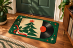 Christmas Vinyl Record Printed Floor Mat, lifestyle view 1: One mat laid flat INSIDE the front door, full landscape mat and all four rounded corners visible at small accent-mat scale, angled downward photography.