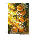 Citrus floral garden flag with orange slices, white blossoms, green leaves, and warm stained glass artwork.