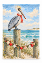 Coastal Pelican Christmas Printed Garden Flag on a white background, showing the complete printed design.