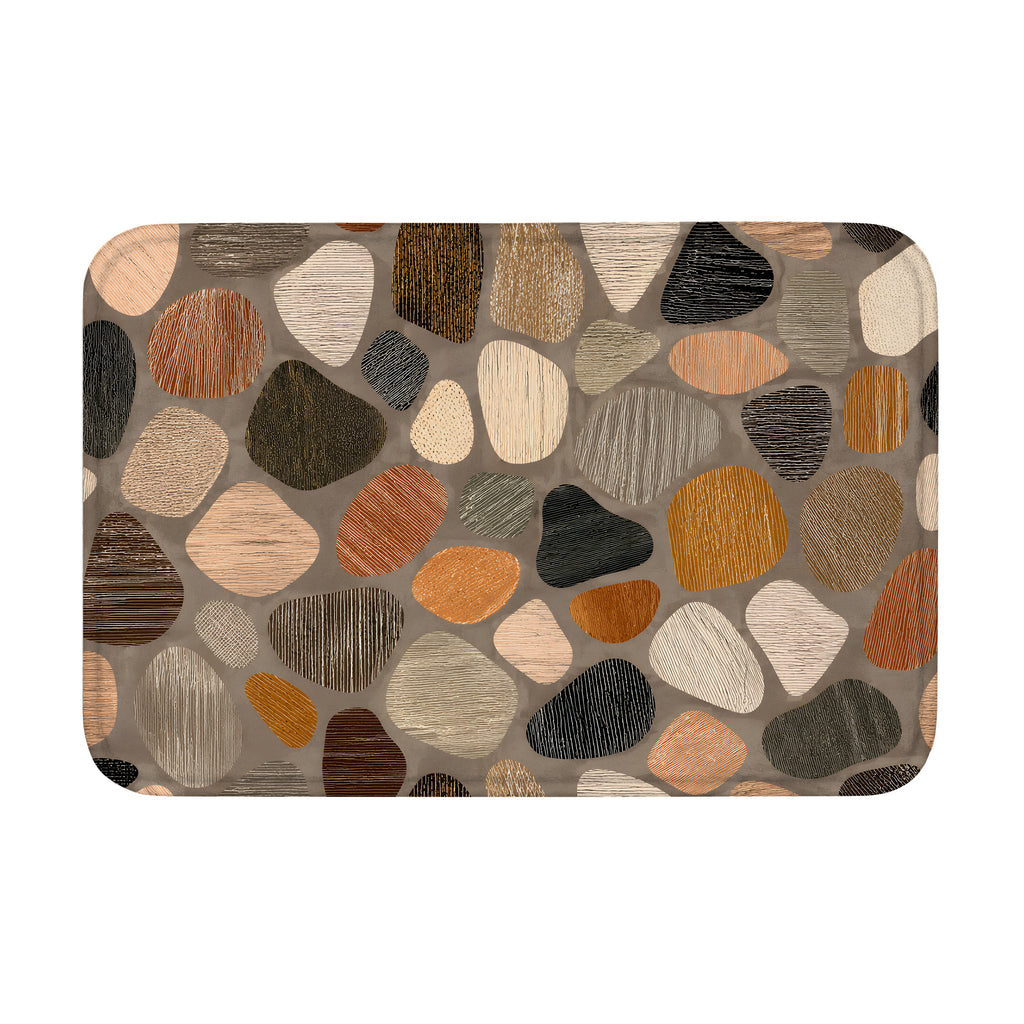 Cobblestone pattern doormat with textured multi-colored stone shapes in earthy tones.