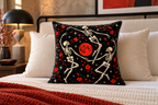 Dancing Skeletons Printed Velvet Pillow Cover, lifestyle view 3: Centered in front of plain pillows on a neatly made guest bed; eye-level composition, believable 18-inch pillow scale.