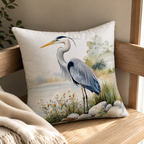 Farmhouse-style heron pillow cover displayed on a wooden chair with warm sunlight.