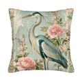 Floral heron throw pillow cover with pink blossoms on a blue background