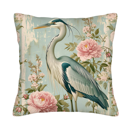 Floral heron throw pillow cover with pink blossoms on a blue background