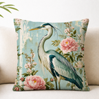 Floral heron throw pillow cover styled on a neutral sofa