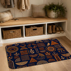 An entryway doormat with navy and orange geometric patterns styled below a wooden shoe bench.