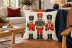 Geometric Nutcracker Christmas Printed Pillow Cover, lifestyle view 1: Placed upright on an accent chair, nearly frontal with full print clearly visible; room-wide interior composition.