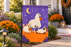 Ghost Dogs Halloween Printed Garden Flag, lifestyle view 2: One flag on a separate black garden stake along a short garden path, lower garden view with planting behind; no people, full rectangle visible.