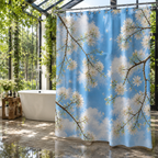 Luxury bathroom designed like a glass greenhouse filled with climbing green vines, featuring a bright blue sky and white blossom shower curtain.