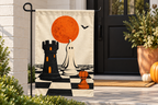 Halloween Chess Pieces Printed Garden Flag, lifestyle view 3: Closer view of the flag on its separate black L-shaped stake near a porch post, the real cloth top sleeve threading over the horizontal bar, print clearly readable.