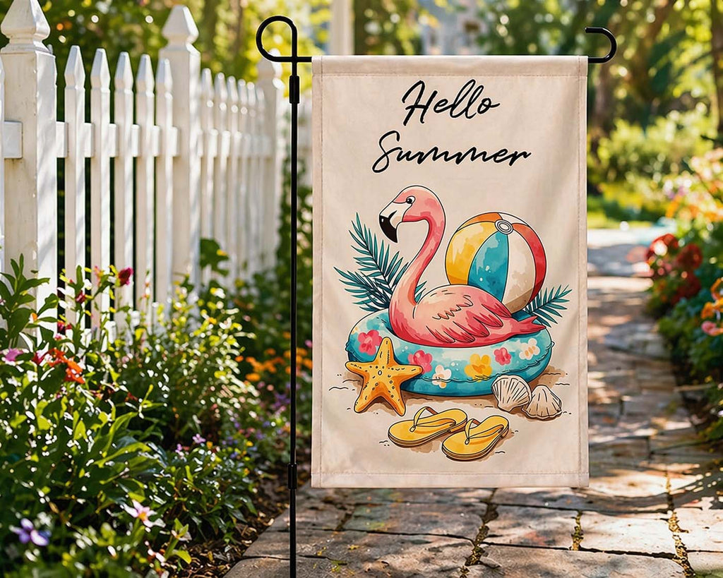 Hello Summer flamingo garden flag displayed along a sunny garden walkway