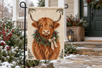 Highland Cow Christmas Printed Garden Flag, lifestyle view 2: One flag on a separate black garden stake along a short garden path, lower garden view with planting behind; no people, full rectangle visible.