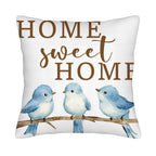 Home Sweet Home pillow cover with three blue watercolor birds on white background.