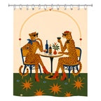 Fun illustration shower curtain showing two leopards wearing sunglasses at a cafe table.