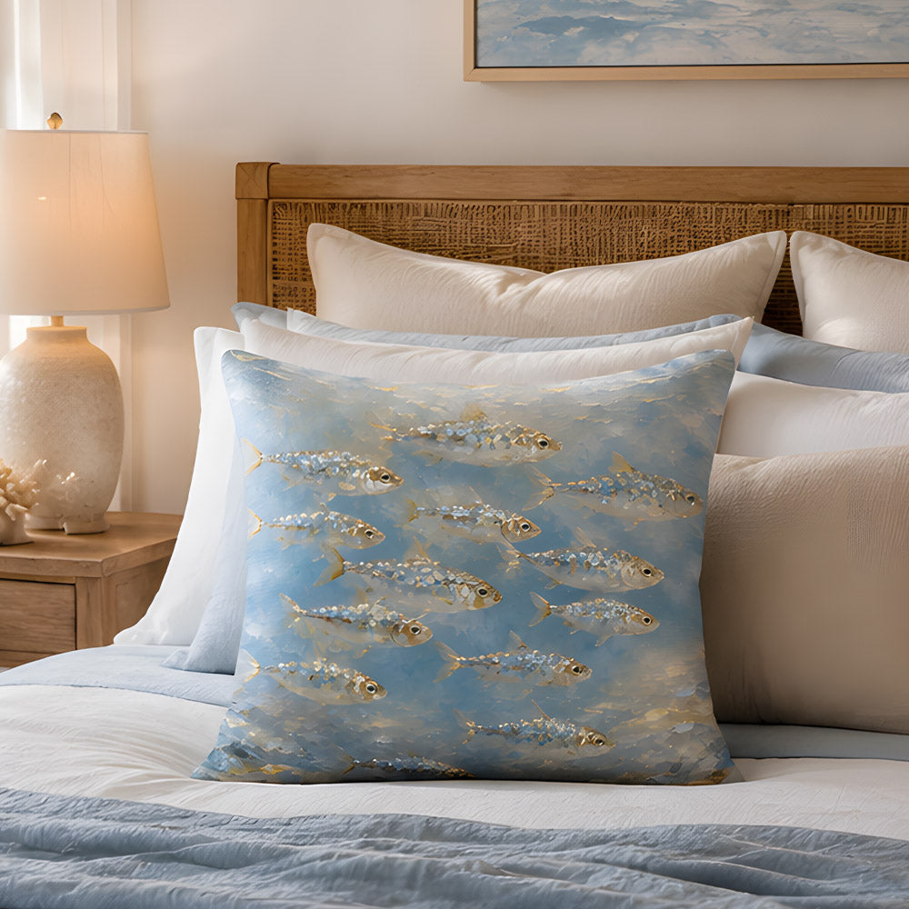 A beautiful marine fish oil painting accent pillow arranged on a luxury bed with a woven rattan headboard, crisp white and light blue bedding, and a glowing bedside lamp.
