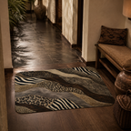 A detailed look at the wavy safari patterned doormat decorating a warm hallway entry next to a bench.