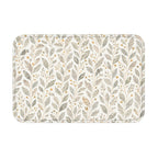 A rectangular modern botanical doormat featuring a seamless pattern of soft grey and green leaves with golden berries on a clean white background.