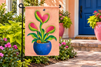 Monster Venus Flytrap Printed Garden Flag, lifestyle view 2: One flag on a separate black garden stake along a short garden path, lower garden view with planting behind; no people, full rectangle visible.