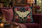 Moon Moth Floral Printed Velvet Pillow Cover, lifestyle view 2: A prominent single pillow on a sofa beside one plain solid-colored cushion; medium interior composition, product fills at least 40 percent of frame.