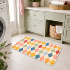 Pastel harlequin bath mat styled in a bright laundry room.