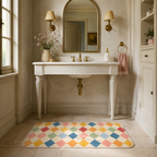 Pastel harlequin bath mat styled in front of a vintage bathroom sink.
