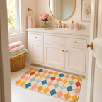 Pastel harlequin bath mat placed in front of a bathroom vanity.