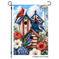 Patriotic garden flag featuring red cardinal and bluebirds perched on American flag themed birdhouses with summer flowers.