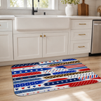Creative patriotic theme floor mat styled on a wooden floor in front of a white farmhouse kitchen sink.
