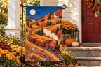 Pumpkin Harvest Train Printed Garden Flag, lifestyle view 3: Closer view of the flag on its separate black L-shaped stake near a porch post, the real cloth top sleeve threading over the horizontal bar, print clearly readable.