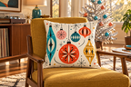 Retro Christmas Ornament Printed Velvet Pillow Cover pillow covers, lifestyle view 1: A low walnut lounge chair with ochre upholstery in an airy American mid-century living room, one small aluminum Christmas tree with coral and turquoise ornaments softly out of focus behind it, late afternoon sunlight and a vinyl console at left.