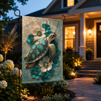 Sea turtle floral garden flag displayed at dusk near a warmly lit front porch, with white hydrangeas and pathway lights.