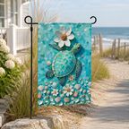 Sea turtle mosaic garden flag displayed beside a sunny beach walkway