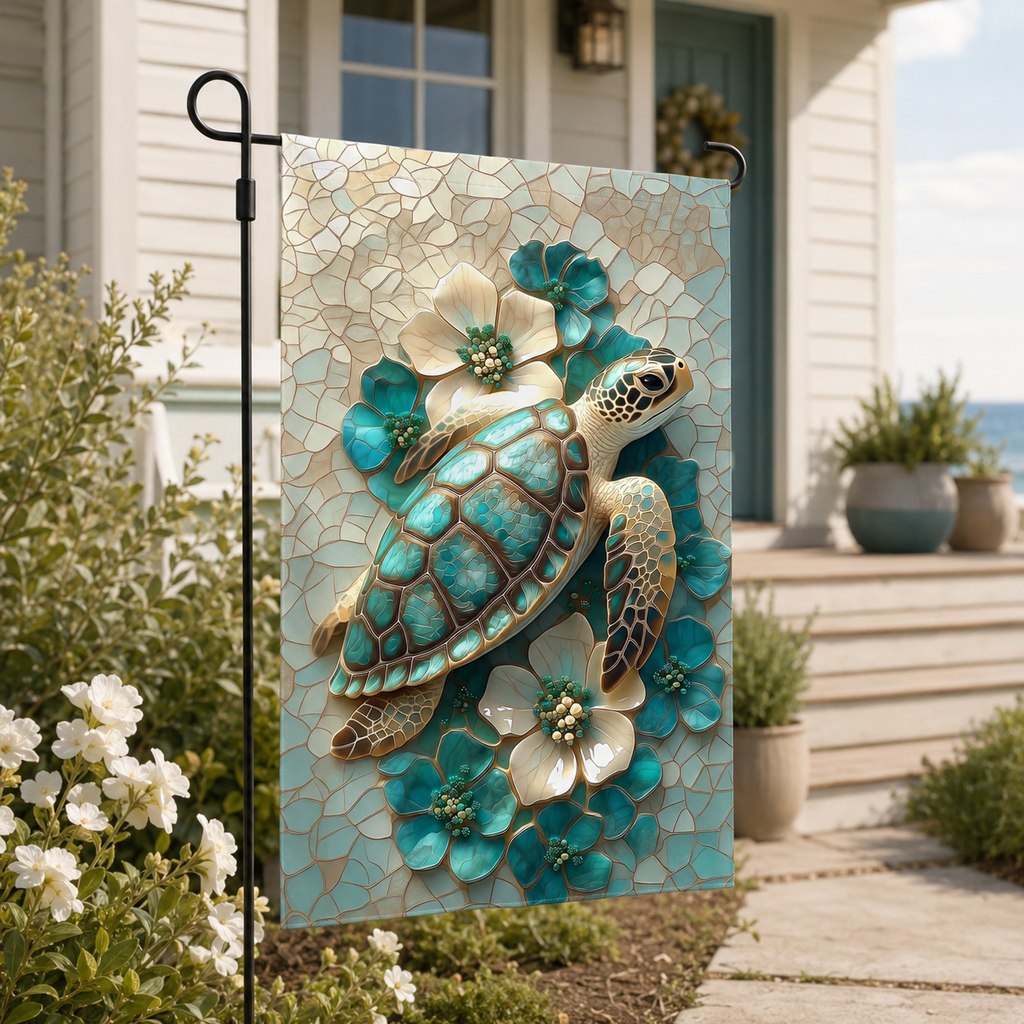 Sea turtle floral garden flag displayed beside a calm coastal porch, with white flowers, soft greenery, and a teal front door.