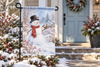 Snowman & Chickadees Printed Garden Flag, lifestyle view 4: One flag on its separate black garden stake in a mailbox garden with restrained October seasonal planting, wide but product-led welcoming suburban scene.
